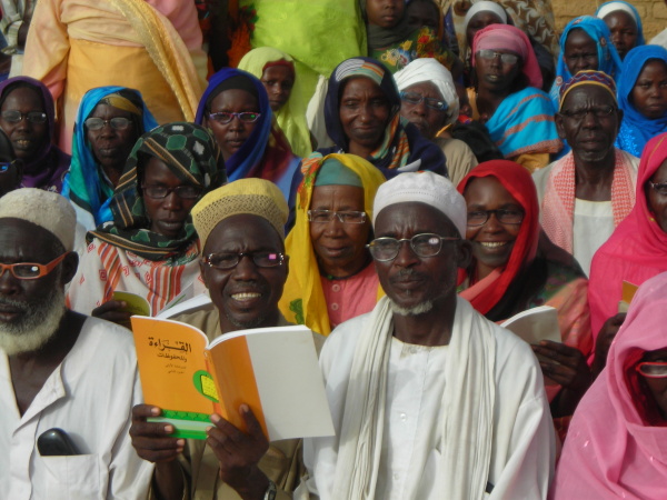 Darfur refugees with new reading glasses in Bredjing Refugee Camp